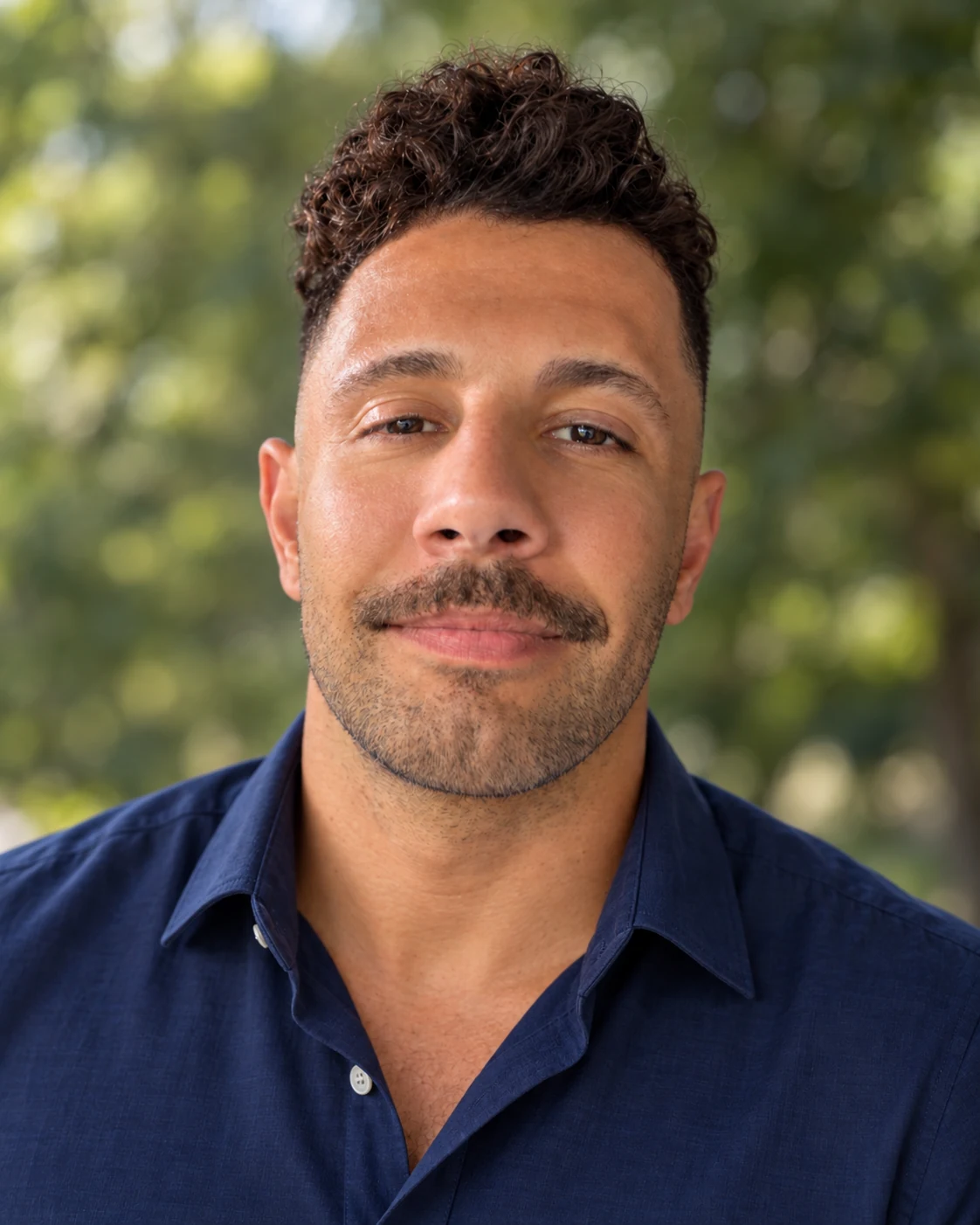 Chris Dassaro, founder and creator of Funded, in a navy dress shirt outdoors